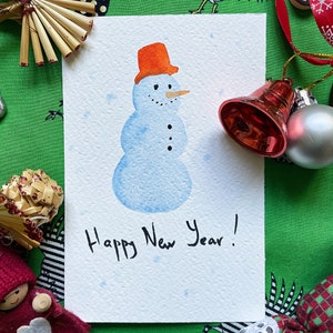 Cartoline fatte a mano con pupazzo di neve ad acquerello, carta di alta qualità