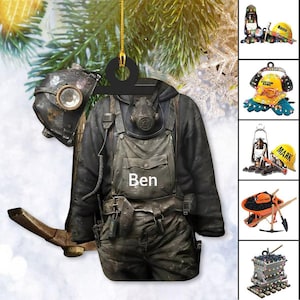 May include: A Christmas ornament featuring a cartoon miner wearing a gas mask, overalls, and a pickaxe. The ornament is decorated with a black and brown color scheme and has the name "Ben" written on the front.