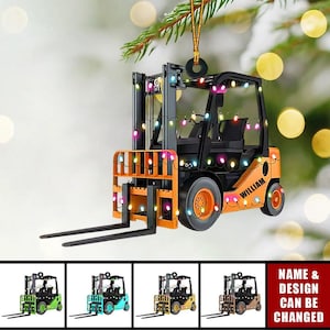 May include: Orange and black forklift Christmas ornament with colorful lights. The ornament is decorated with the name "William".