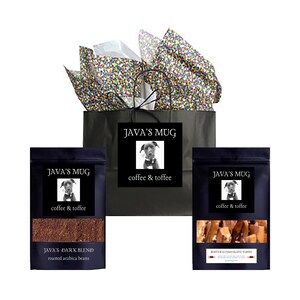 May include: A gift bag with a black and white logo that says "Java's Mug coffee & toffee" and a picture of a dog wearing a bow tie. The bag contains two black bags with the same logo and a bag of coffee beans and a bag of toffee.