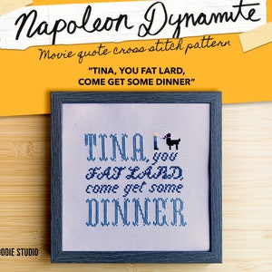 May include: Cross stitch pattern of a framed image with the text "TINA, you FAT LARD, come get some DINNER" in blue lettering. The image also includes a small black dog with a candle on its head.