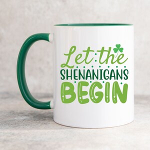 Let The Shenanigans Begin Mug | St Patrick&#39;s Day Coffee Mug | 11oz White Ceramic Cup | Green Handle And Interior | Funny St Paddy&#39;s Day Gift
