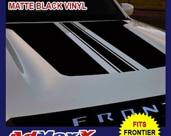 May include: A matte black vinyl hood decal for a 2022 Nissan Frontier. The decal features two wide black stripes with thinner white pinstripes running down the center of the white vehicle hood. Text on the image reads HOOD DECAL FOR NISSAN FRONTIER 2022, MATTE BLACK VINYL, and FITS FRONTIER 2022.