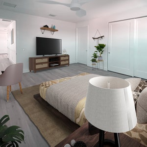Pode incluir: Um quarto com uma cama grande com um edredom estampado em cinza e marrom, um abajur branco com um abajur branco, uma mesa de cabeceira de madeira e uma cômoda de madeira com uma televisão no topo.