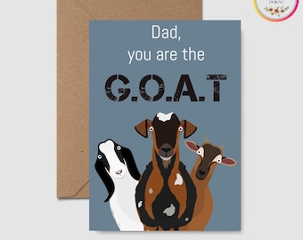 Op de afbeelding: Een wenskaart met een blauwe achtergrond en de tekst "Dad, you are the G.O.A.T." toont illustraties van drie geiten. De kaart wordt geleverd met een bruine envelop en bevat een cirkelvormig logo met bloemmotieven.
