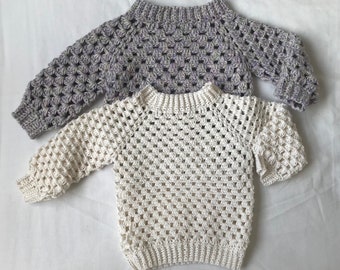 Two Crocheted baby sweaters