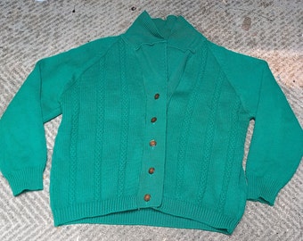 Classic Vintage charm of the 1930s with this exquisite green cabel knit cardigan.