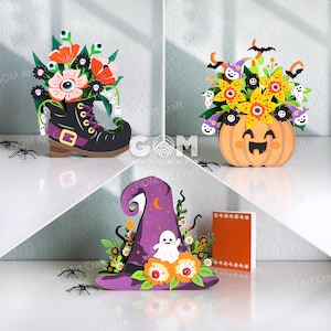 May include: Three decorative paper craft displays featuring Halloween themes. One is a black boot filled with flowers and eyeballs, one is a pumpkin with yellow flowers and ghosts, and one is a purple witch hat with a ghost and orange flowers.