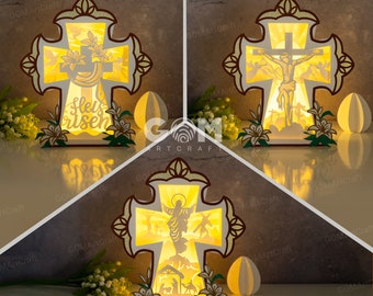 May include: A wooden cross with a light inside, depicting a scene of Jesus on the cross. The cross is decorated with flowers and has the words "Fleis risen" on the front.