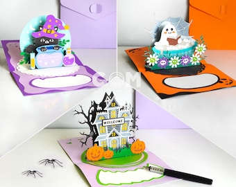 May include: Three pop-up greeting cards featuring Halloween themes. One card shows a black cat in a witch hat with a potion, another a ghost in a bathtub with a spiderweb, and the third a haunted house with pumpkins and the text WELCOME.