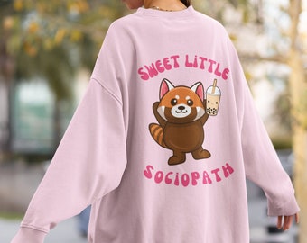May include: Pink sweatshirt with a red panda cartoon holding a boba tea and the text "Sweet Little Sociopath" printed on the back.