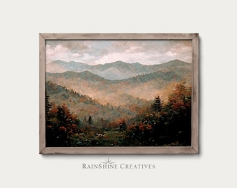 May include: A framed painting depicting a misty mountain landscape in shades of blue and green. The mountains are layered and appear distant. The painting has a rustic, vintage feel.