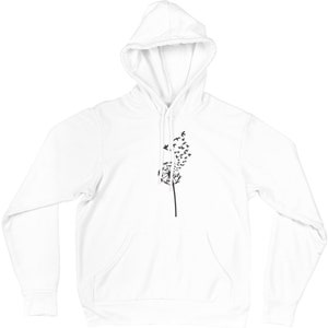 May include: White hooded sweatshirt featuring a black dandelion design. The dandelion is formed from small birds flying away.