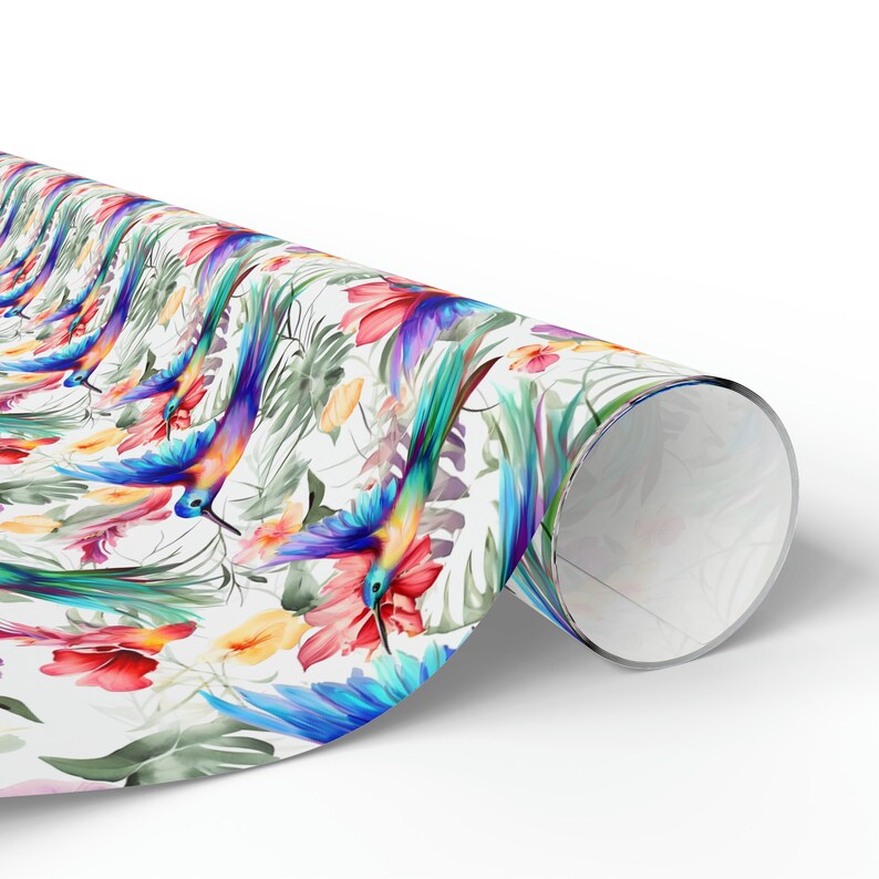 May include: A white background with a repeating pattern of colorful hummingbirds and tropical flowers. The hummingbirds are blue, green, and purple with long, pointed beaks. The flowers are red, pink, and yellow.