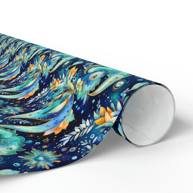 May include: A roll of decorative wrapping paper with a repeating floral pattern. The design features blue, teal, and orange flowers and abstract shapes on a dark blue background. The paper is rolled up, revealing the white interior.