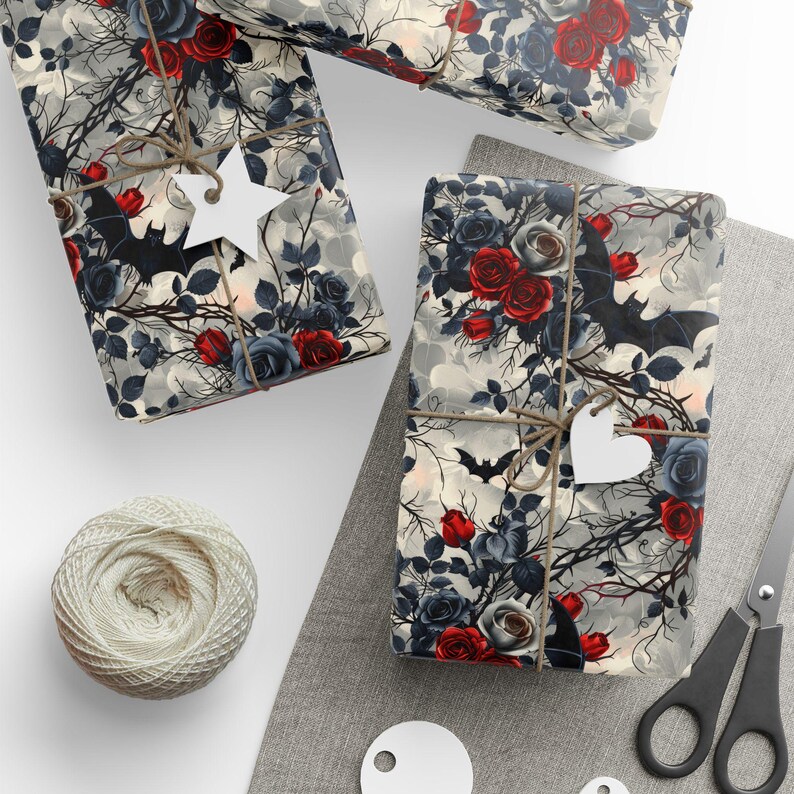 May include: Gift wrap featuring a dark, gothic design with red roses, bats, and a cloudy background.