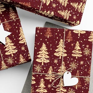 Christmas Wrapping Paper with Gold Christmas Trees on a Deep Red Background.