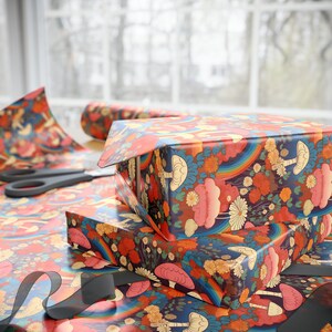 May include: A stack of colorful gift wrap featuring a mushroom and rainbow design. The wrapping paper is folded and ready to be used.