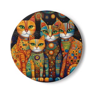 May include: Four colorful cats with patterned fur and large green eyes are sitting together on a dark background. The cats are all different colors and have different patterns on their fur. The background is a dark blue with white dots.