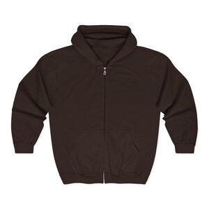 May include: A dark brown zip-up hoodie with a hood and front pockets. The hoodie has a full-length zipper and is made of a soft, comfortable material. The hoodie is a versatile piece of apparel for casual wear.