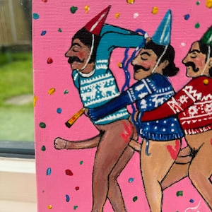 May include: A painting of three figures wearing festive sweaters and party hats. The figures are painted in a cartoon style with exaggerated features and are standing on a pink background with confetti.
