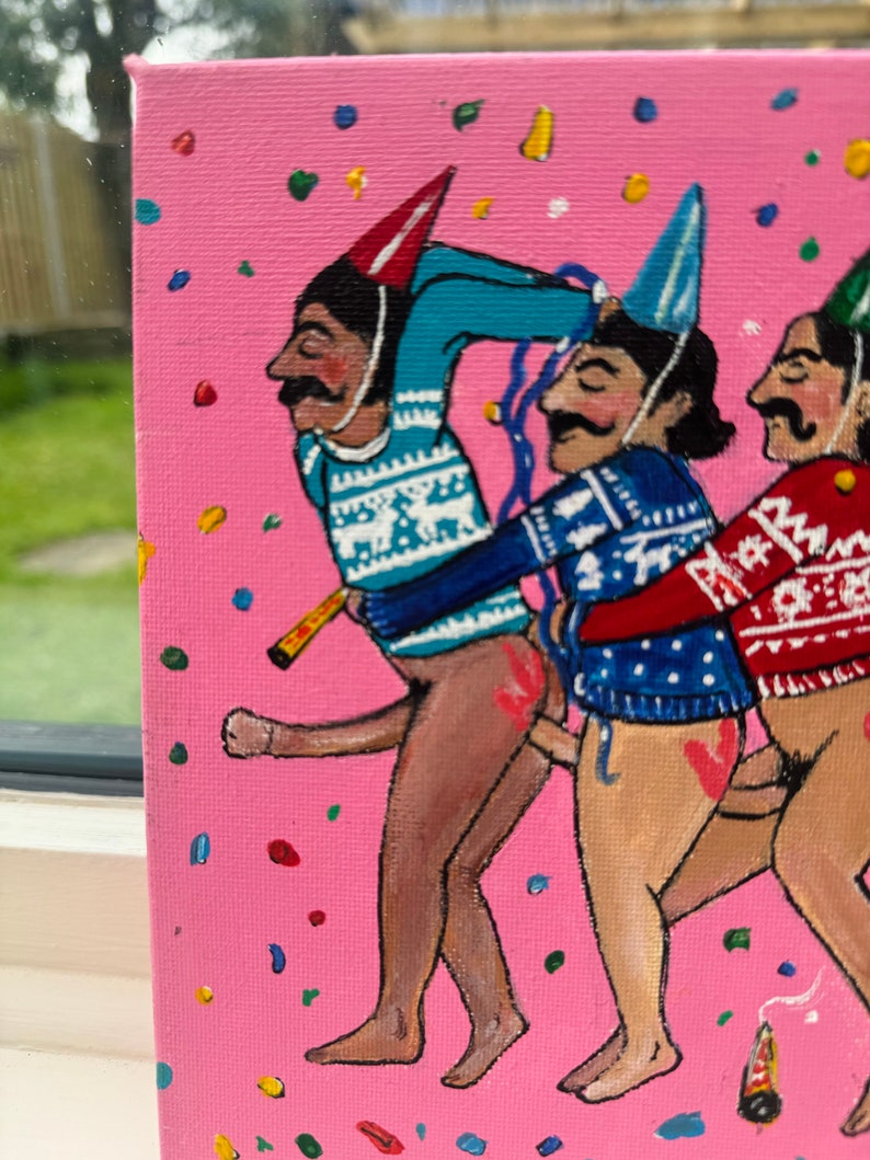 May include: A painting of three figures wearing festive sweaters and party hats. The figures are painted in a cartoon style with exaggerated features and are standing on a pink background with confetti.