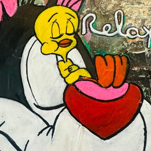 May include: A yellow cartoon bird with closed eyes is nestled in the crook of a black cat's arm. The cat has pink ears and a white heart shape painted on its chest. The background is a textured green and brown canvas with the word "Relax" painted in white.