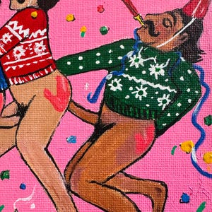 May include: Two people in party hats and sweaters are celebrating with confetti and streamers. One person is holding a party blower. The painting is on a pink background.