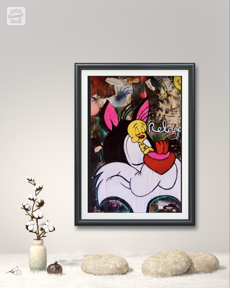 May include: A framed painting of a cartoon cat and bird with the word "Relax" written in pink letters. The background is a collage of colorful textures and patterns.
