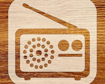May include: A wooden radio-shaped cutout with a light wood grain finish. The radio design features a rectangular body, a speaker with circular holes, two circular dials, and an antenna. The cutout is set against a wooden background.