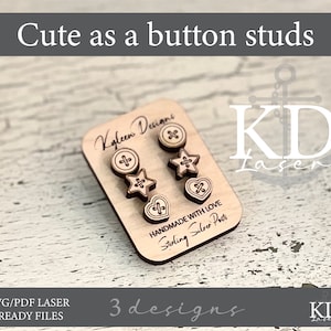 May include: A set of three laser cut wooden earrings in the shape of a button, a star, and a heart. The earrings are on a white card with the text "Kyleen Designs" and "Handmade with Love Sterling Silver Posts".
