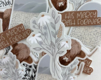 May include: A set of stickers featuring a highland cow, a floral bouquet, and the phrase "His Mercy Endureth Forever". The stickers are printed on white paper with a matte finish.