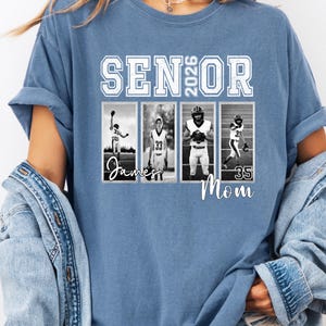 May include: A blue t-shirt with the words "SENIOR 2026" in white block letters. Below the text are four black and white photos of football players. The names "James" and "Mom" are written in cursive.