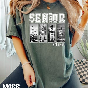 May include: A moss green t-shirt with the text "SENIOR 2026" in white block letters. Below the text are four black and white photos of football players. The word "Mom" is printed below the photos. The word "MOSS" is printed in white at the bottom.