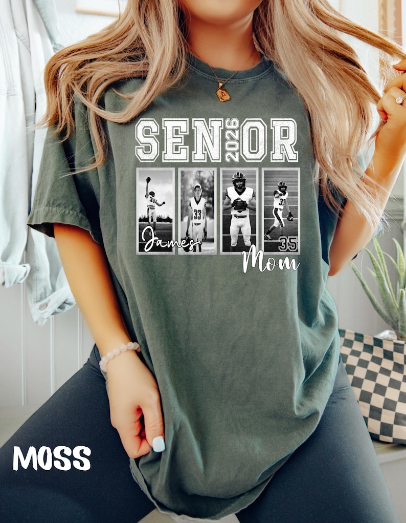 May include: A moss green t-shirt with the text "SENIOR 2026" in white block letters. Below the text are four black and white photos of football players. The word "Mom" is printed below the photos. The word "MOSS" is printed in white at the bottom.