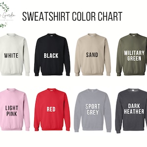 Pode incluir: Carta de cores que mostra dez cores diferentes de sweatshirts. As cores s&atilde;o branco, preto, areia, verde militar, rosa claro, vermelho, cinza esportivo, cinza escuro mesclado, azul marinho e azul-petr&oacute;leo.