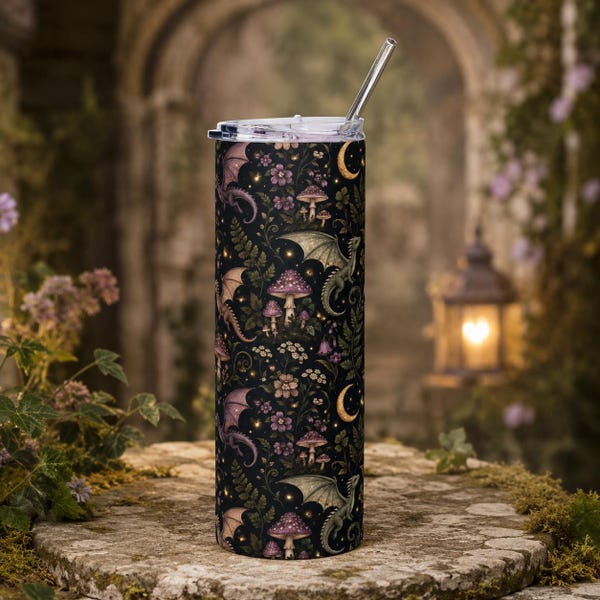 May include: A cylindrical stainless steel tumbler with a black background featuring a repeating pattern of purple and green dragons, various mushrooms, small flowers, ferns, and golden crescent moons, topped with a clear lid and metal straw.