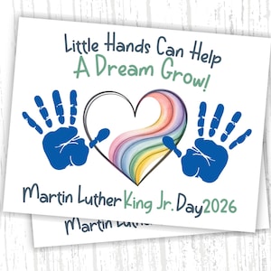 May include: Two white cards with the text "Little Hands Can Help A Dream Grow!" and "Martin Luther King Jr. Day 2026". The design includes blue handprints, a rainbow heart, and a black outline heart.