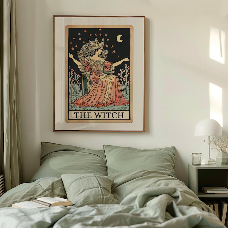 May include: Framed tarot card art print featuring a seated figure in a crown and flowing gown, set against a starry night sky with a crescent moon. The text "THE WITCH" is at the bottom. The artwork is in a wooden frame.
