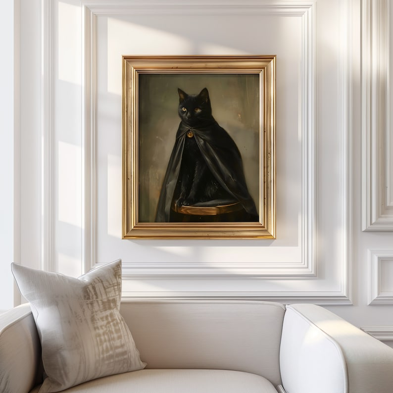 May include: A framed painting of a black cat wearing a black cape and sitting on a stool. The cat has a gold collar with a bell.