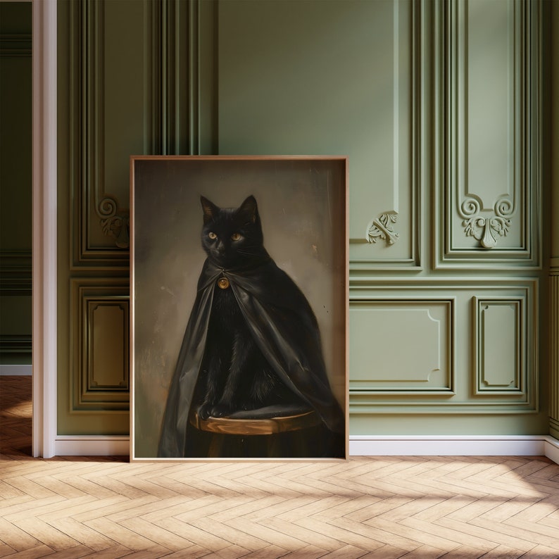 May include: A black cat wearing a black cape sits on a wooden stool. The cat has yellow eyes and a gold bell around its neck. The background is a green wall with ornate molding.