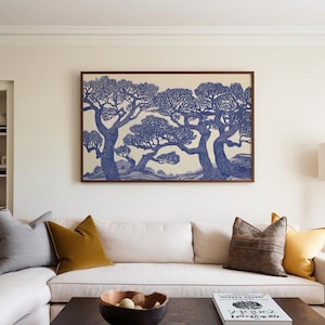 May include: A framed print of a blue and white illustration of three trees with branches reaching out. The trees are set against a light background with a hint of blue.