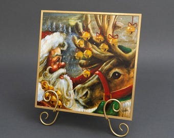 Christmas Canvas Art - Christmas Canvas Painting Santa with a Reindeer Painting 12"x12" Painting with Easel | Holiday Art Decor