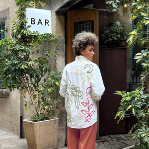 Upcycled customized white coloured light denim jacket