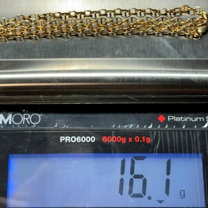 May include: A gold chain necklace weighing 16.1 grams on a digital scale. The scale reads "PRO6000 6000g x 0.1g" and "Platinum Scale".