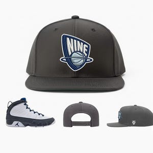 May include: A dark gray flat-brimmed baseball cap with a white and blue embroidered logo that says "NINE" above a basketball. A pair of white and navy blue basketball shoes are also shown.
