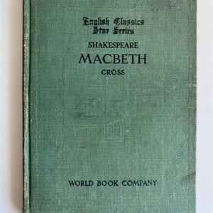 May include: A vintage copy of Shakespeare's "Macbeth" with a green cover. The title and author are in black text. The book is part of the "English Classics Star Series" and published by the "World Book Company".