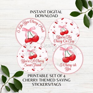 May include: A printable set of four cherry-themed stickers/tags. Each circular sticker features a pair of red cherries with a pink bow and a unique phrase in red text, such as "I Like You Cherry Much."