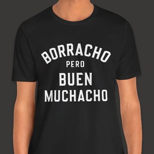 May include: Black t-shirt with white text that reads "Borracho pero buen muchacho"