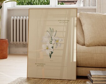 May include: A framed print with a white flower illustration and the text "All these people think love's for forever, but I would die for you in secret."